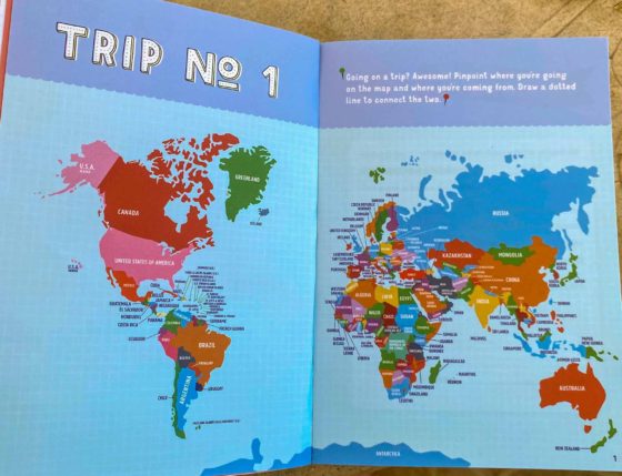 Close-up of a colourful map of the world, inside a children's travel journal book