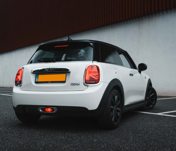 A white Mini Cooper car viewed from behind
