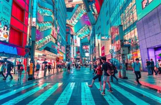 Illuminated busy shopping street in Tokyo, Japan