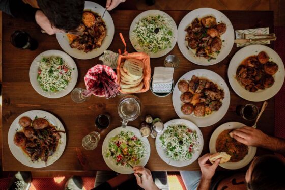 Overhead view of a family meal laid out on a table