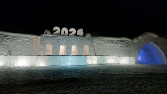Building made out of snow with '2024' displayed on the roof
